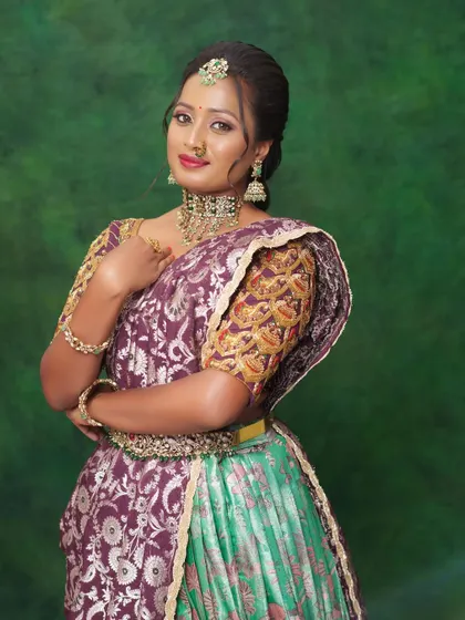 A smiling portrait of the model, showing how the makeup enhances her features beautifully.