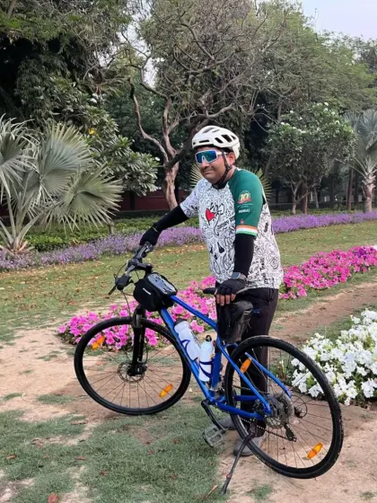 Another rider from our Thursday morning spin, posing with his bike amidst the greenery. It's all about miles and smiles.