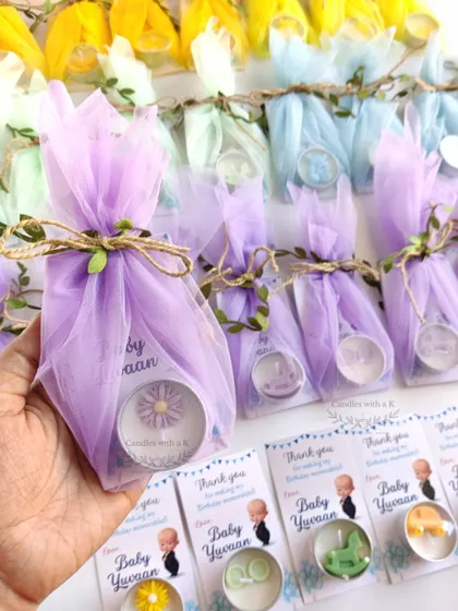 The tealight candles beautifully wrapped in pastel-colored net, ready to be gifted to birthday party guests.