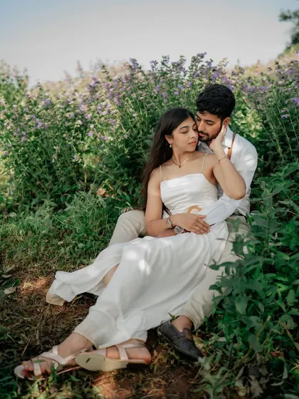 A tender moment shared while sitting amongst the wildflowers. This kind of intimate couple photography captures the quiet side of their love.