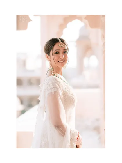 A simple, elegant portrait of the bride. Her happy expression and the soft, flattering light make this a beautiful and timeless shot.