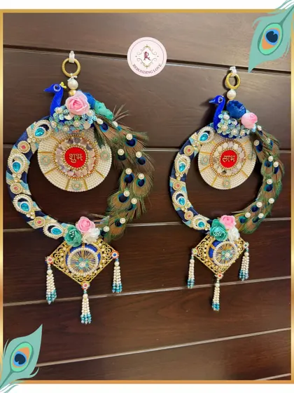 This pair of Peacock Shubh Labh hangings shows the complete set, ready to adorn your doorway. The symmetry and detailed craftsmanship make them a timeless treasure.