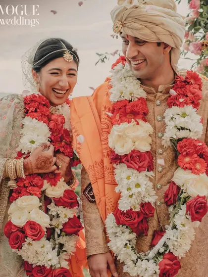 Unrestrained laughter after the varmala ceremony, this candid photo perfectly captured the couple's happiness for their Vogue feature.