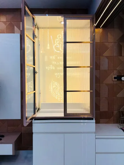 Another view of the concealed mandir, showing how the fluted glass doors swing open to transform the cabinet into a place of worship.