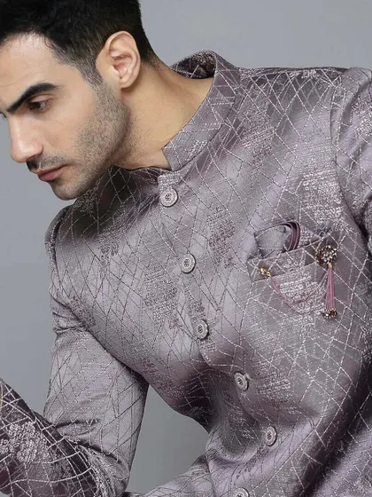 A close-up of the lavender Indo-Western. The intricate texture and subtle sheen make this pre-loved piece a true standout.