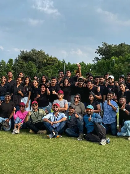 The full team, all smiles after a successful corporate event. We believe that a well-executed offsite can significantly boost morale and team cohesion.