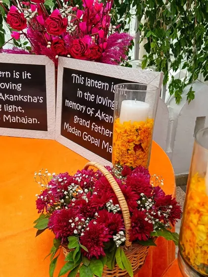 A memorial table with lanterns dedicated to the loving memory of the bride's grandfather and guiding light. This is a thoughtful way to include and honor family members who have passed.