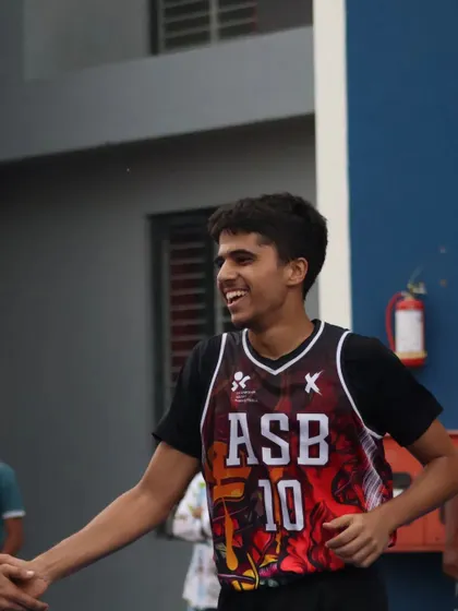 The joy of the game is evident in this player's smile. I create a positive environment where athletes can build friendships and share their passion for basketball.