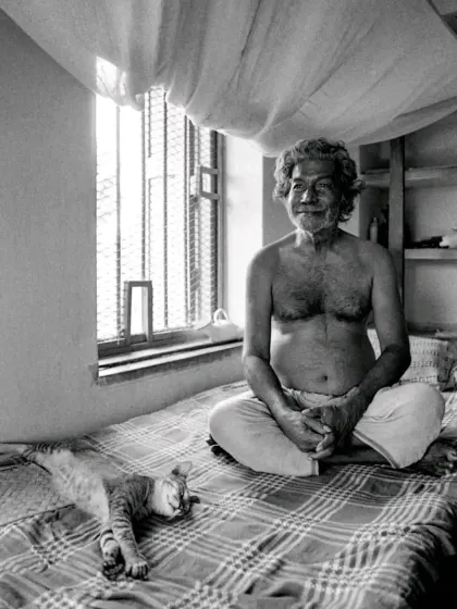 A timeless portrait of artist Ramkinkar Baij with his cat. We are deeply inspired by the profound connection between people and their animals throughout history, a bond we aim to honor in our own work.