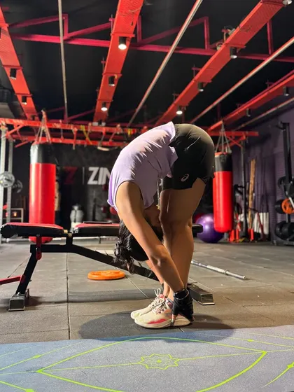 A forward fold is a great way to stretch the hamstrings and release tension in the lower back after a tough workout. Flexibility is a key component of a balanced fitness program.