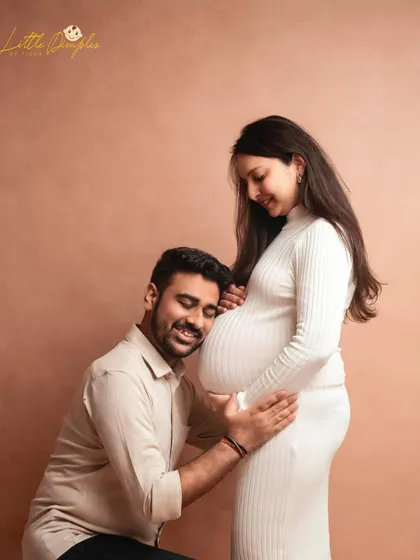 The dad-to-be listening to the baby bump is always a heartwarming shot. It’s a classic pose that captures the excitement and connection.