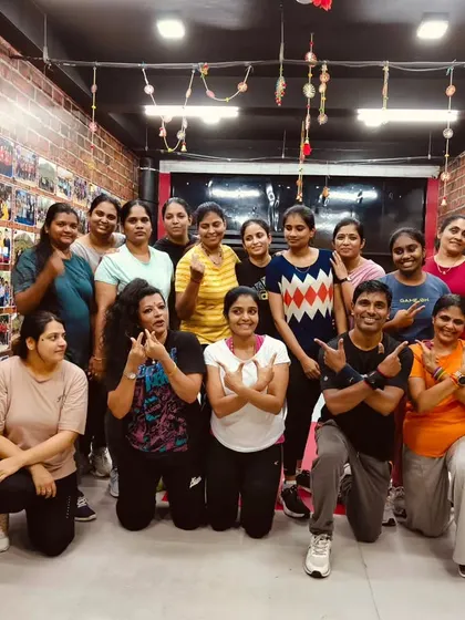 The energy in this photo is electric. Our members know how to have fun and support each other through every workout.