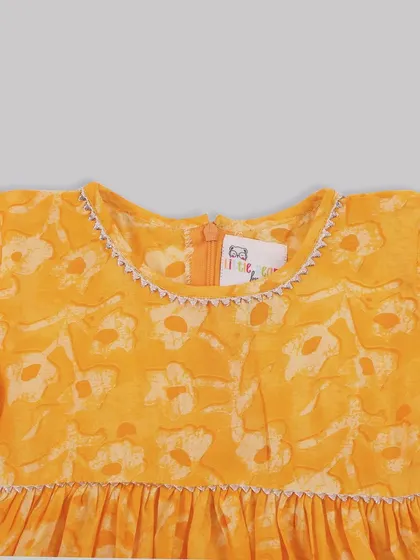 A close-up of the delicate stitching around the neckline of one of our floral dresses. I believe true fashion isn't just what you wear, but how it makes you feel.