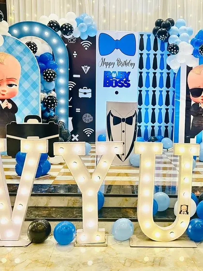 The main stage for Avyukt's Boss Baby birthday party, featuring multiple character cutouts and large marquee letters.