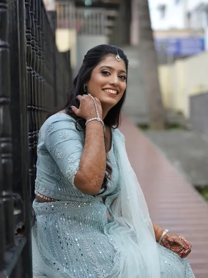 A happy, smiling shot. The makeup is designed to look fresh and natural, even with a full glam outfit.