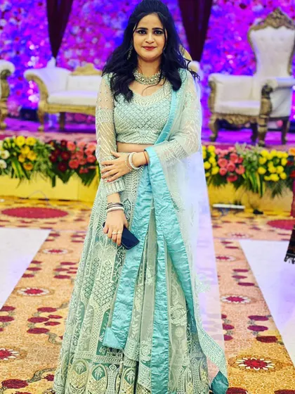 This client looks stunning in a sea-green chikankari lehenga. It’s a beautiful and elegant rental outfit for a day wedding or reception.