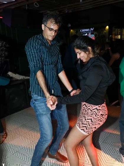 A fun, energetic moment between two dancers. The smiles and laughter are what our socials are all about.
