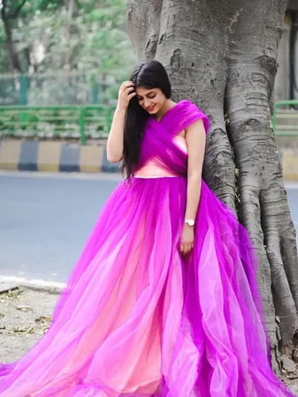 This beautiful pink and purple dual-shade gown is a unique piece in my collection. It's perfect for an outdoor shoot where the colors can truly shine.