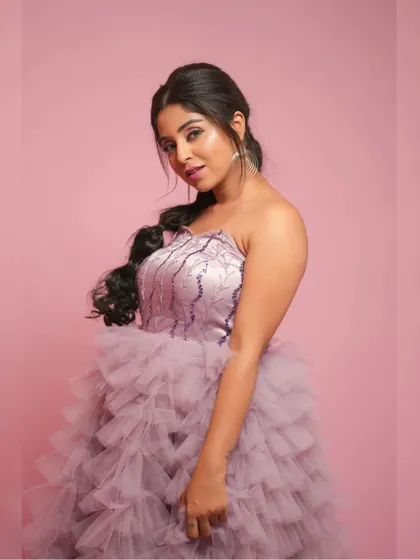 A beautiful portrait pose in the shoulderless purple multilayer gown.