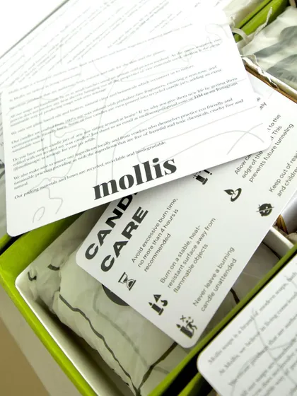 A peek inside the Rakhi gift box, showing the candle care and soap care cards that I include with every order.