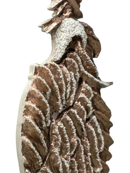 A close-up of the diamond-encrusted head and textured wings of "The Bronze Guardian." The details are essential to capturing its majestic character.