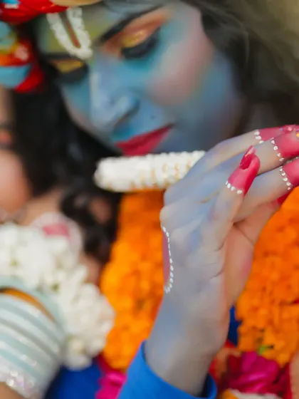 A macro shot of the hand details and the flute, showing that every part of the look is carefully considered.