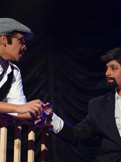 Character interaction is key to storytelling. Here, two actors from 'Khamosh Adalat Jari Hai' are deep in a crucial dialogue.
