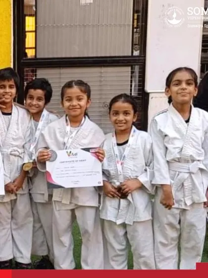 A group of our junior girl judokas proudly showing their certificates and medals from the Inter School Judo Championship.