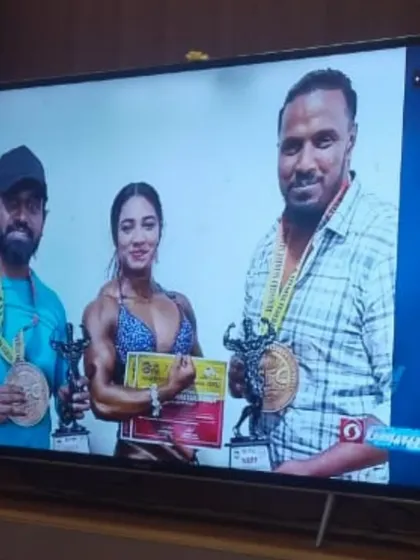 A live television broadcast showing me with my trophies and medals. This is a proud moment, sharing my victory with a wider audience.