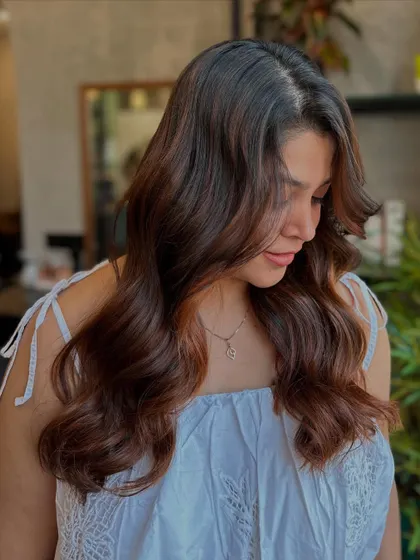 A profile view of the Cinnamon Sugar look, showing how the color frames the face and adds warmth to the client's complexion.