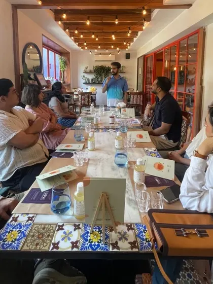 A group listens intently during our kombucha workshop. We hold our sessions in beautiful, relaxed cafe settings to make learning a comfortable and social experience.