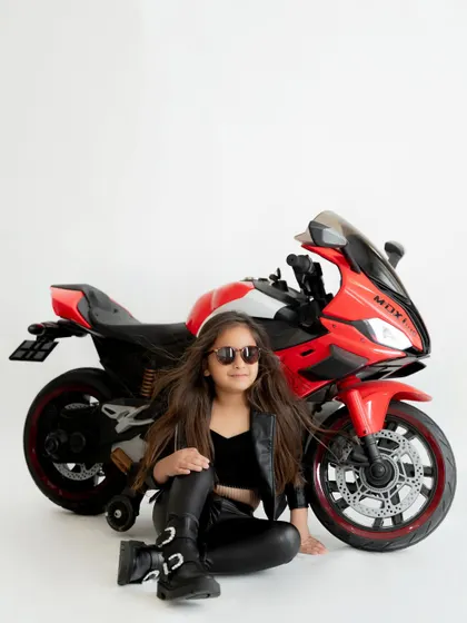Born to be wild! For her fifth birthday, she wanted a biker theme, and we were happy to bring in this cool toy motorcycle to complete her edgy look.