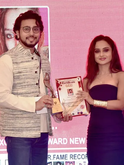 On stage with my trophy and certificate at the Gee Awards 2023. Thank you to the entire team for this honor.