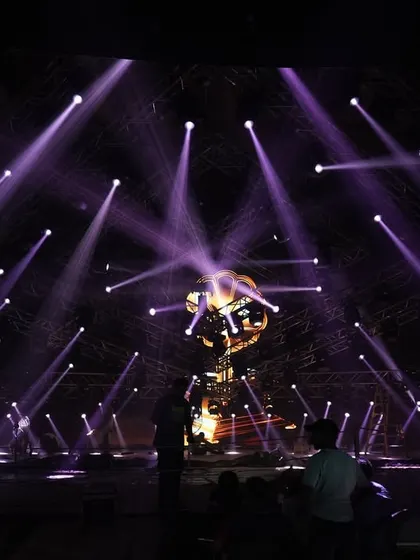 The 'Po Po' song set during a lighting check, with purple beams creating a dramatic web of light.