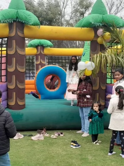 Kids enjoying the spacious jungle bouncy castle at an outdoor birthday party. I handle the complete setup and takedown, so you can focus on the event.