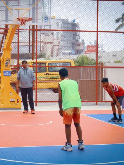 We provide access to modern, well-maintained basketball courts across the city. This court is set up for a junior league game, demonstrating a clean playing surface perfect for both competitive matches and casual games.