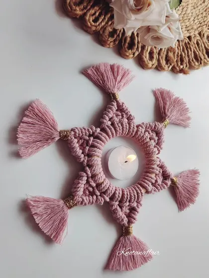 This beautiful macrame tealight candle holder can also be used as a small placemat. It's a versatile piece that can be a great addition to your table decor.