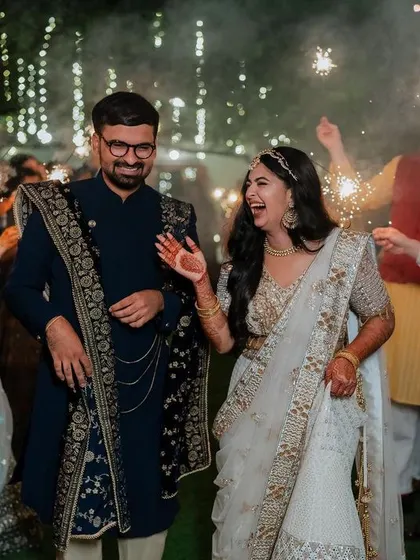 A lively entrance with friends and sparklers. We capture the collective joy and celebration of your Sangeet night, creating images that are full of energy and happiness.