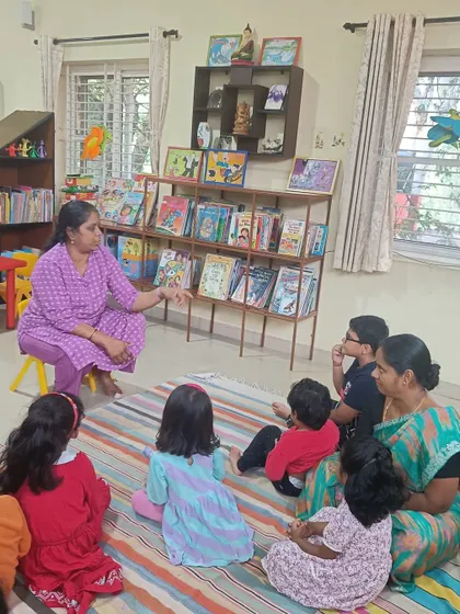 Another perspective of the storyteller interacting with the children and the book.