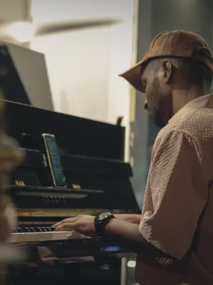 A pianist focused on the keys during a live R&B show. The versatility of our space and gear allows us to host a wide variety of musical genres.