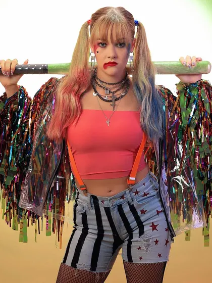 Another dynamic shot from the Harley Quinn series, with the character holding her iconic baseball bat. The background effect adds a sense of motion and chaos.