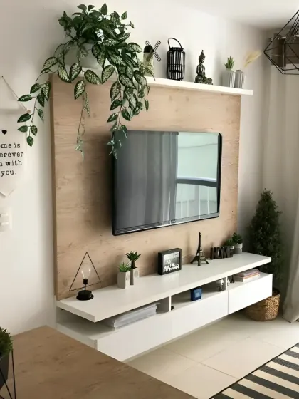 A simple and effective TV unit for a smaller space. The floating design keeps the floor clear, and the wood panel adds a touch of warmth.