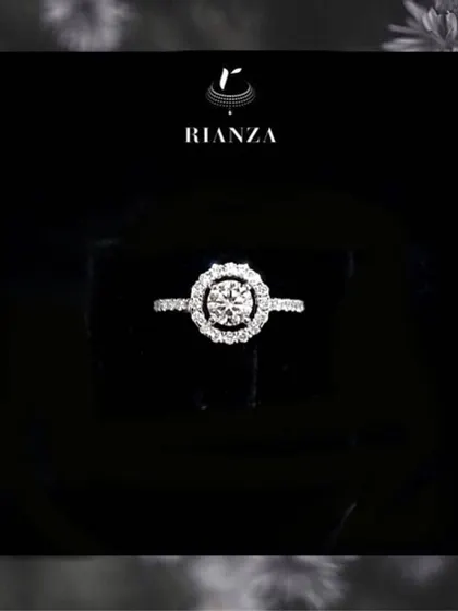 A duplicate image of the classic round solitaire in a halo setting, emphasizing its evergreen appeal. This design is beloved for its ability to maximize the diamond's brilliance.