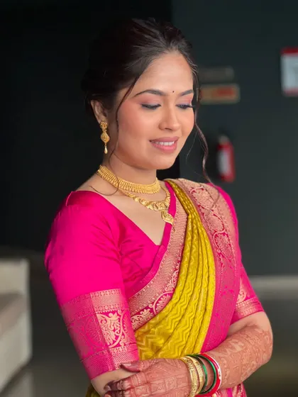 A close-up of my bride Shrishti's vidhi look, featuring soft, glowing makeup and a simple gold necklace.