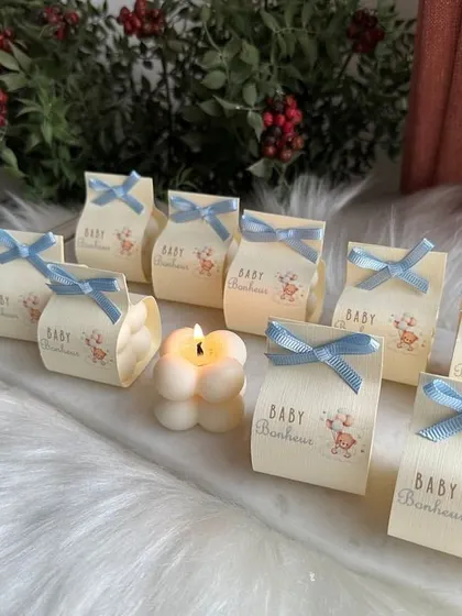 Another baby shower packaging option, this time with a "Baby Bonheur" theme and a light blue ribbon.