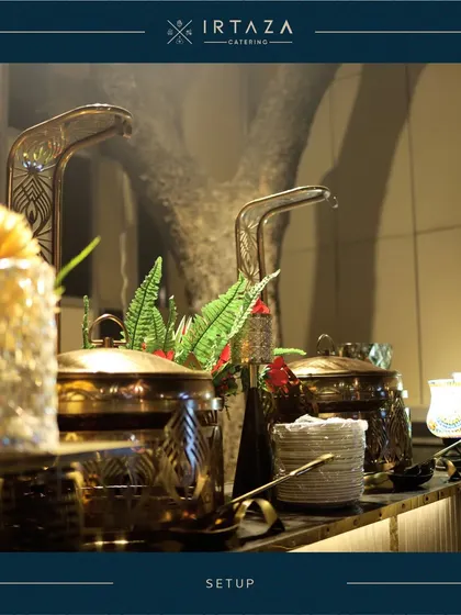 A detailed shot of the unique, artistic handles on my golden serving pots. It's small details like these, combined with fresh greenery, that contribute to a truly bespoke and high-end catering presentation.