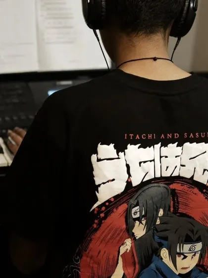 A student wearing a Naruto shirt while practicing piano. We love when students express their interests and feel at home in our classes.