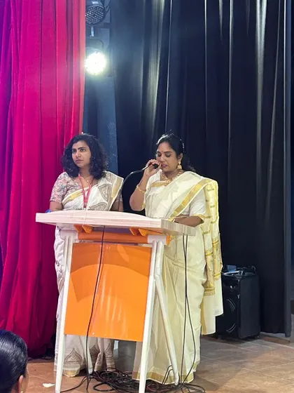 Teachers address the audience during the Hindi Diwas program, sharing their thoughts on the importance of the language.