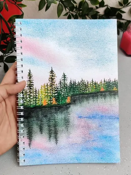 The third design in my notebook series features a serene forest and lake scene. All my notebooks are A5 size with metal wiro binding and 75 GSM paper.