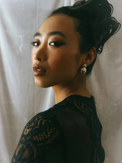 A classic portrait with an elegant updo. This type of headshot showcases the model's bone structure and versatility for more sophisticated roles or campaigns.